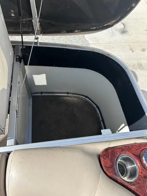 Slide: The Image of Open storage compartment on 2010 Sun Tracker PARTY BARGE 22 Regency Edition boat. - 29