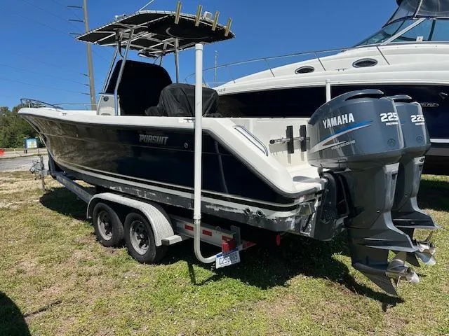 Slide: The Image of 2006 Pursuit 2670 Center Console boat with twin Yamaha 225 engines on a trailer. - 0