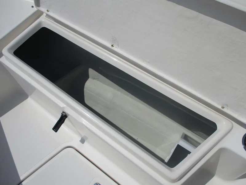 Slide: The Image of Storage compartment on a 2006 Pursuit 2670 Center Console boat. - 12