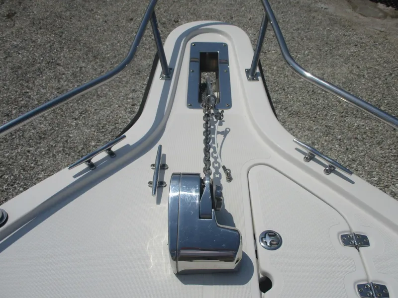 Slide: The Image of Bow of 2006 Pursuit 2670 Center Console with anchor chain and winch. - 14