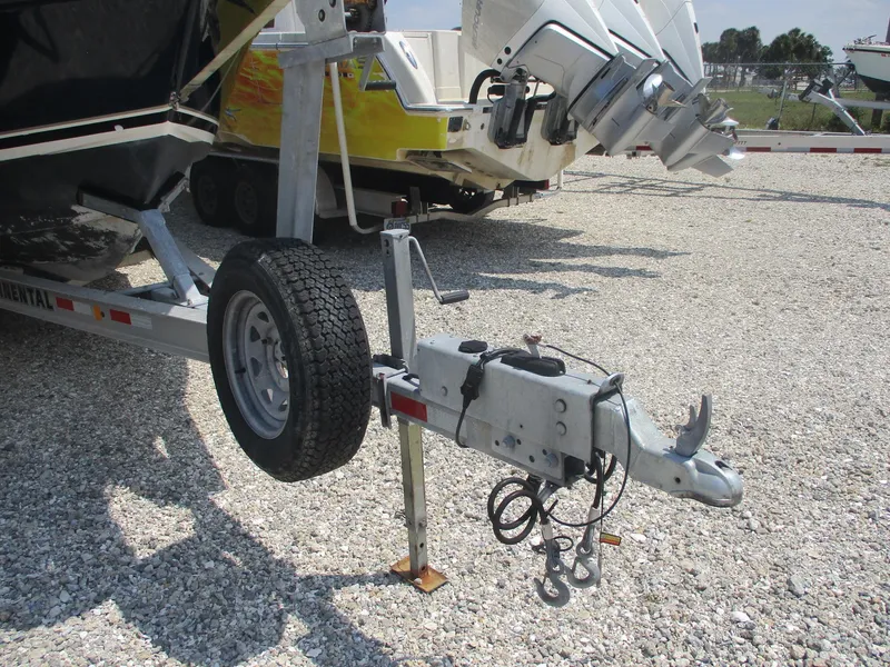 Slide: The Image of Trailer hitch of a 2006 Pursuit 2670 Center Console boat on gravel. - 20