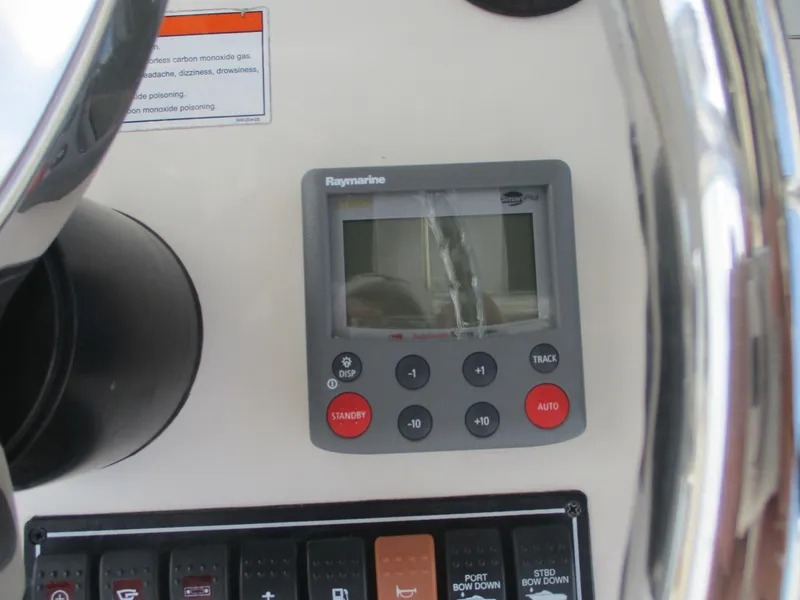 Slide: The Image of Control panel of a 2006 Pursuit 2670 Center Console boat with Raymarine display. - 28