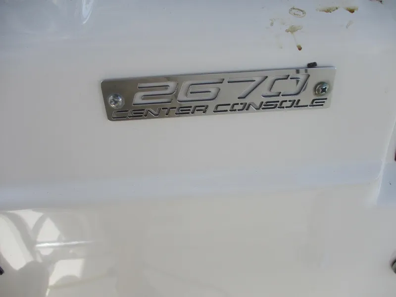 Slide: The Image of 2006 Pursuit 2670 Center Console nameplate on white surface. - 29