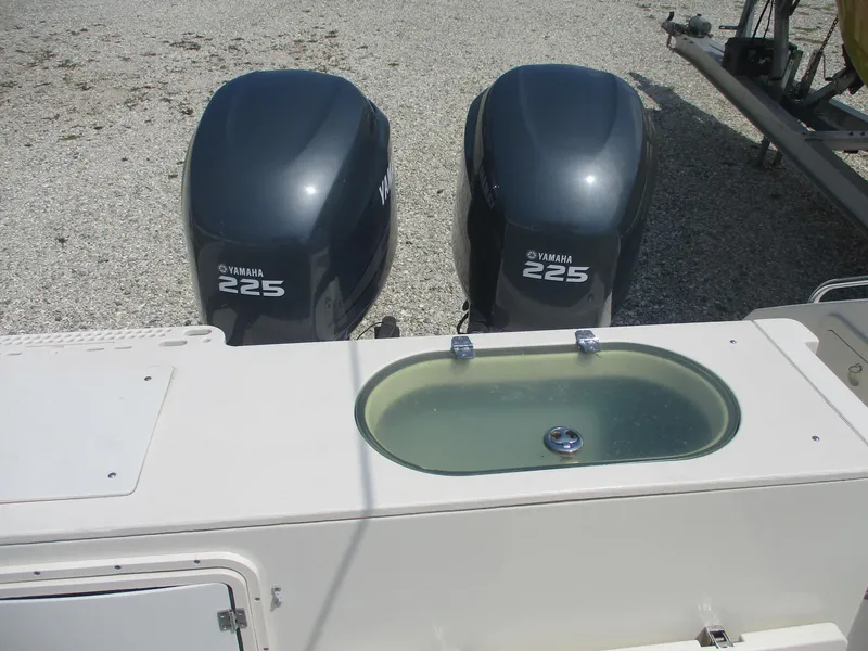 Slide: The Image of 2006 Pursuit 2670 Center Console with twin Yamaha 225 engines and livewell. - 3