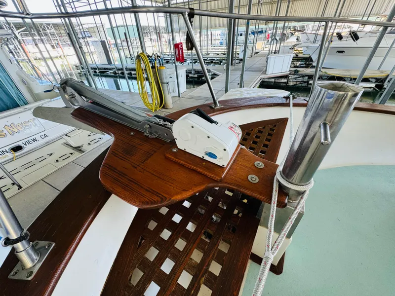 Slide: The Image of 1984 Fu Hwa Sea Horse 34 yacht deck with anchor mechanism and marina background. - 10