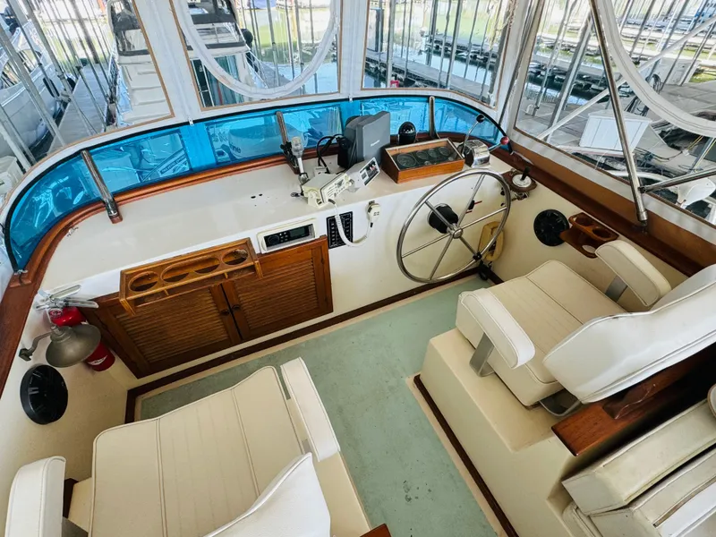 Slide: The Image of 1984 Fu Hwa Sea Horse 34 boat interior with steering wheel and seating area. - 20