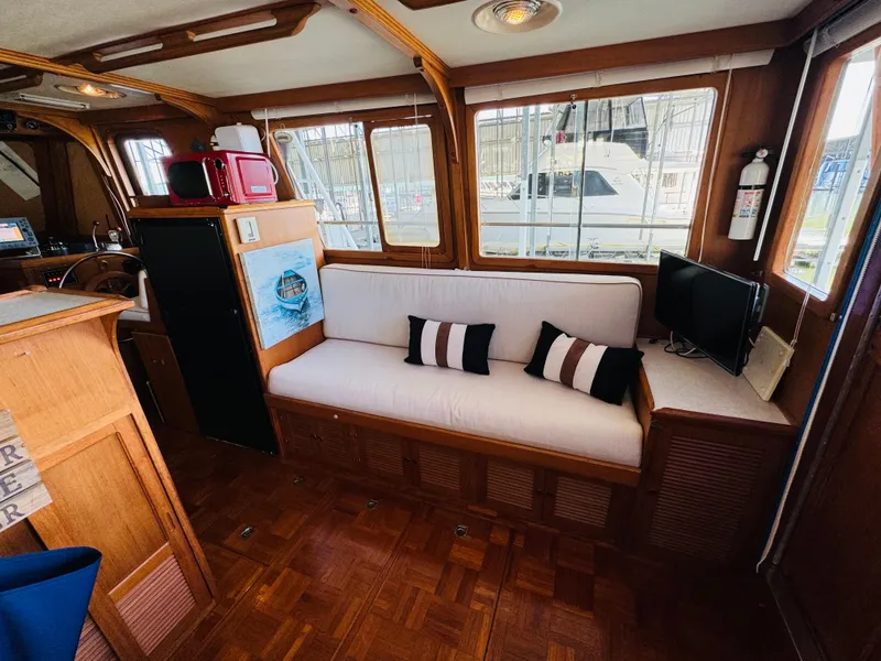 Slide: The Image of Interior of 1984 Fu Hwa Sea Horse 34 yacht with cozy seating and nautical decor. - 26