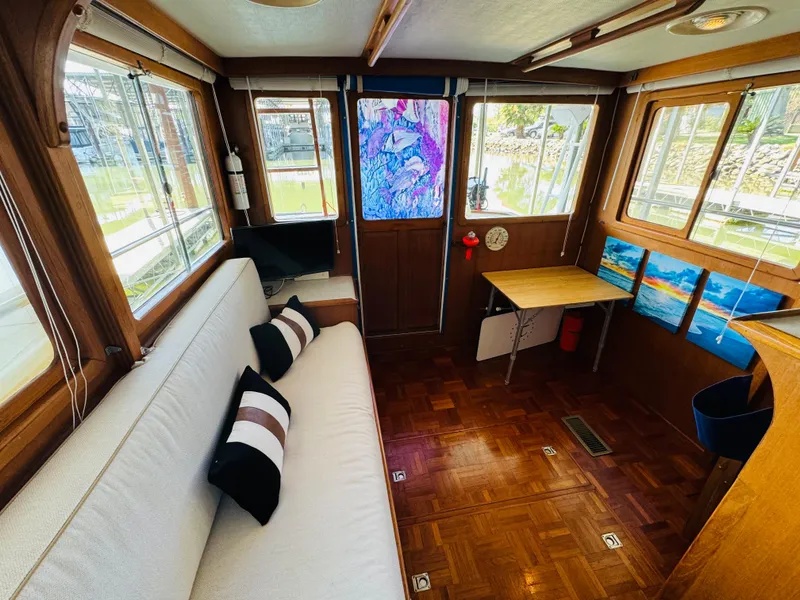 Slide: The Image of Interior of 1984 Fu Hwa Sea Horse 34 boat with cozy seating and wooden decor. - 28