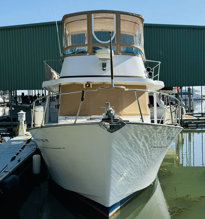 Slide: The Image of 1984 Fu Hwa Sea Horse 34 boat docked in marina, front view. - 3