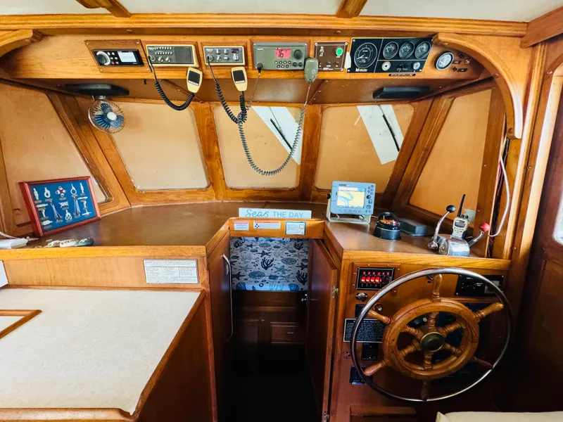Slide: The Image of 1984 Fu Hwa Sea Horse 34 boat interior with wooden helm and navigation instruments. - 31
