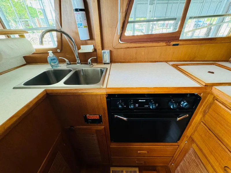 Slide: The Image of 1984 Fu Hwa Sea Horse 34 yacht kitchen with dual sink and stove. - 34