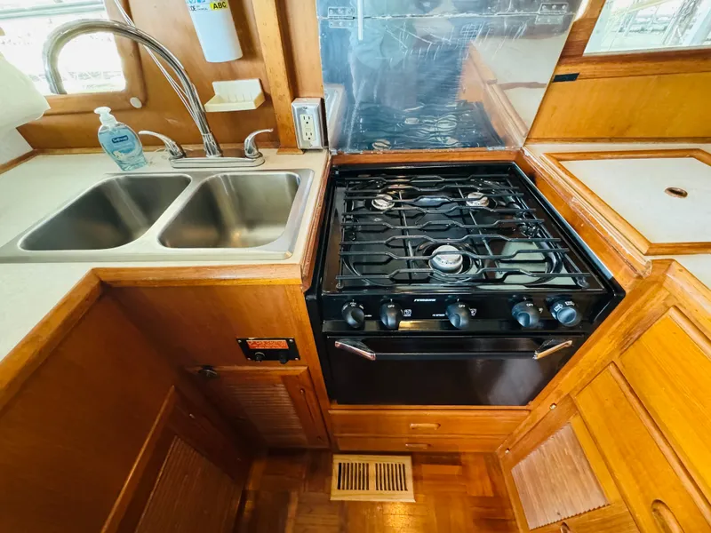 Slide: The Image of Compact kitchen in 1984 Fu Hwa Sea Horse 34 boat with stove and double sink. - 35