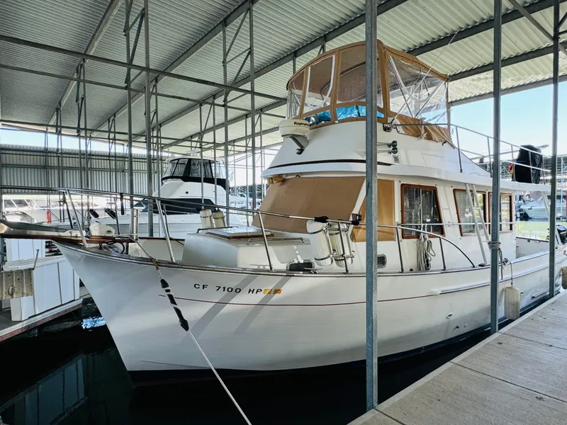 Slide: The Image of 1984 Fu Hwa Sea Horse 34 yacht docked in a covered marina. - 6