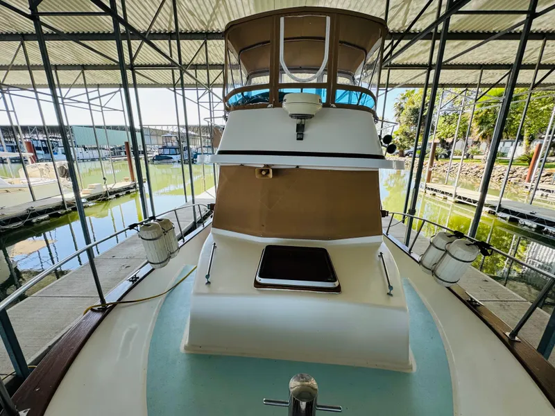 Slide: The Image of 1984 Fu Hwa Sea Horse 34 yacht docked in a covered marina. - 9