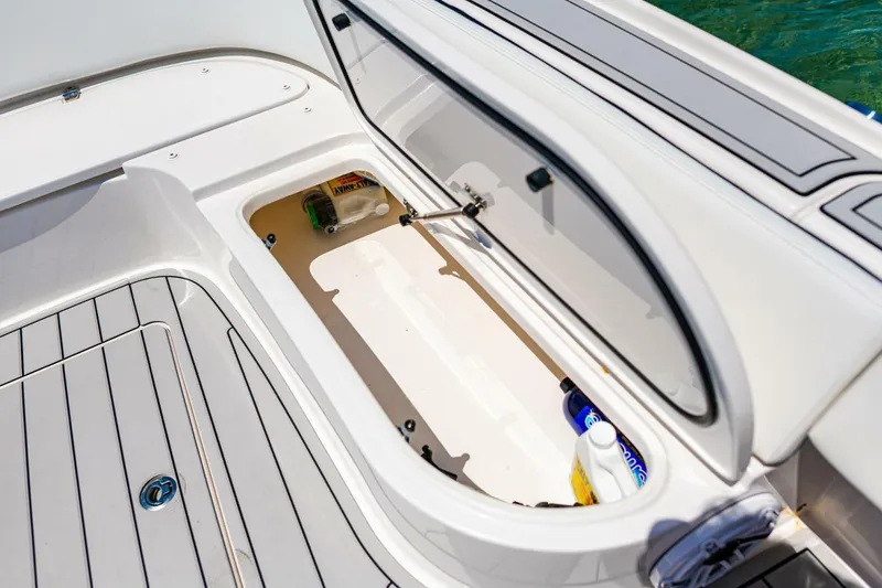 Slide: The Image of Open storage compartment on 2023 Contender 25 Bay boat, showcasing interior space and design. - 11