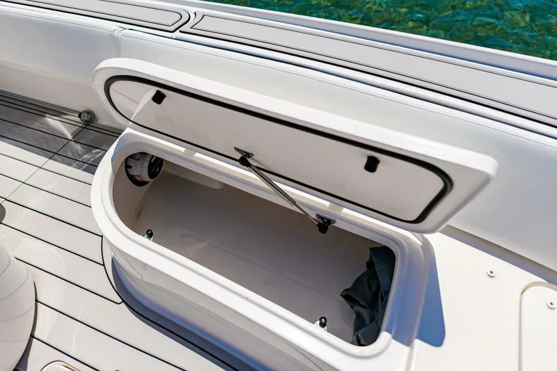 Slide: The Image of Open storage compartment on 2023 Contender 25 Bay boat, showcasing interior space. - 12