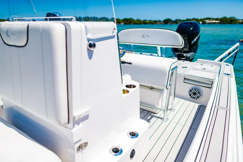 Slide: The Image of 2023 Contender 25 Bay boat interior with sleek white design and modern features. - 17