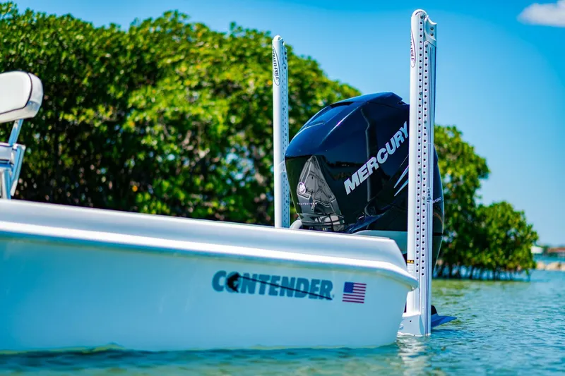 Slide: The Image of 2023 Contender 25 Bay boat with Mercury engine in scenic water setting. - 37