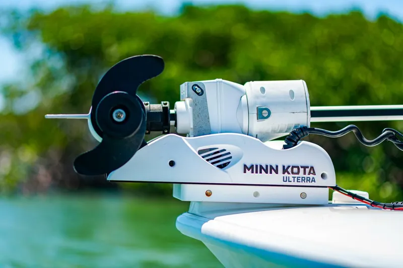 Slide: The Image of Minn Kota Ulterra motor on 2023 Contender 25 Bay boat, close-up view. - 5
