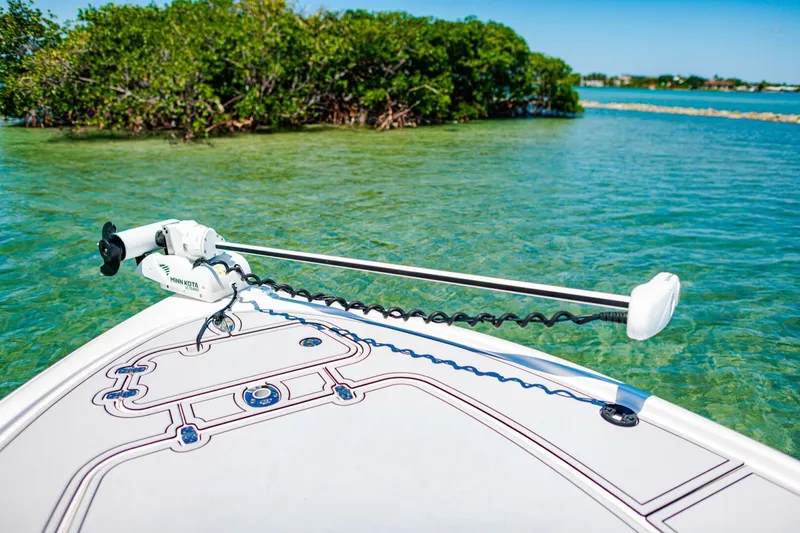 Slide: The Image of 2023 Contender 25 Bay boat in clear water near mangroves. - 6