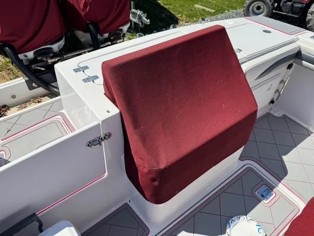 Slide: The Image of 2008 Donzi 35ZX boat interior with maroon cover and gray flooring. - 11