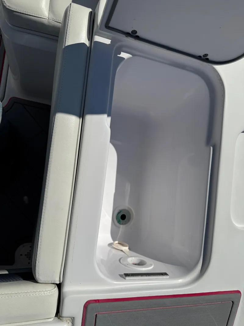 Slide: The Image of 2008 Donzi 35ZX boat interior compartment with white upholstery and storage space. - 20