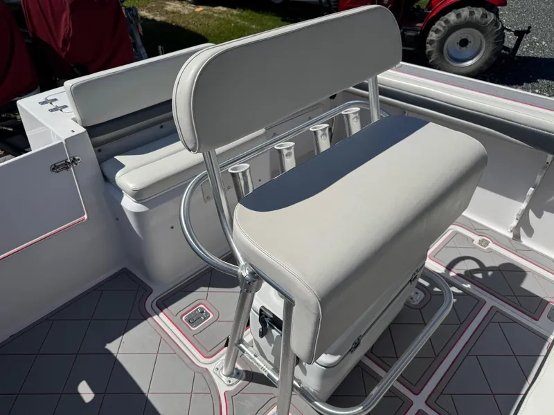 Slide: The Image of 2008 Donzi 35ZX boat interior with cushioned seating and rod holders. - 22