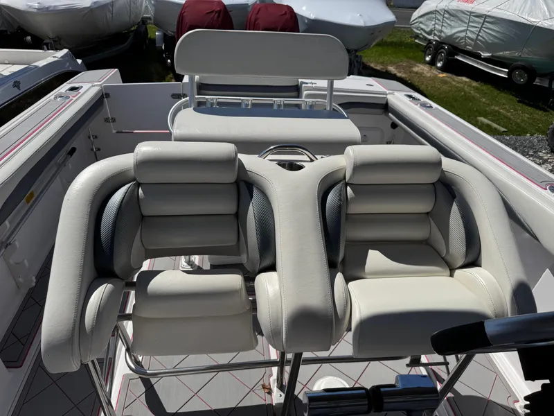 Slide: The Image of 2008 Donzi 35ZX boat interior with plush white seating and steering wheel. - 24