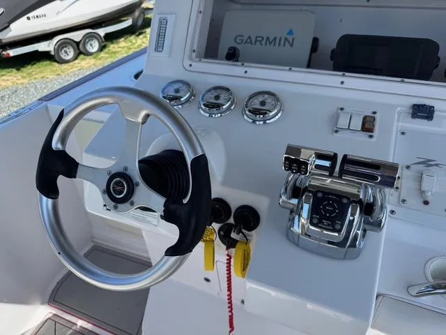 Slide: The Image of Control panel of a 2008 Donzi 35ZX boat with Garmin navigation system. - 26
