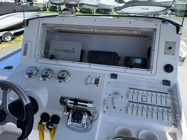 Slide: The Image of Control panel of a 2008 Donzi 35ZX boat with Garmin navigation system. - 27