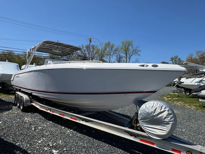 Slide: The Image of 2008 Donzi 35ZX boat on trailer, parked outdoors on gravel. - 5
