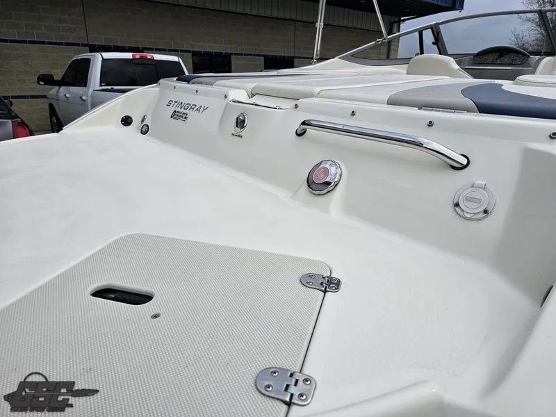 Slide: The Image of 2013 Stingray 225 LR boat deck with sleek design and stainless steel fittings. - 31