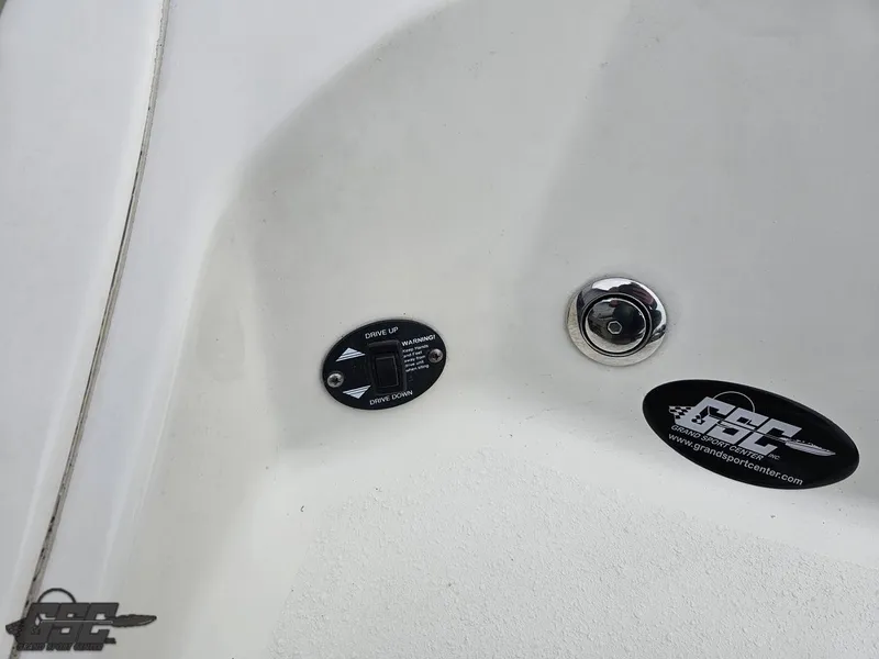 Slide: The Image of 2013 Stingray 225 LR boat interior with control panel and logo. - 38