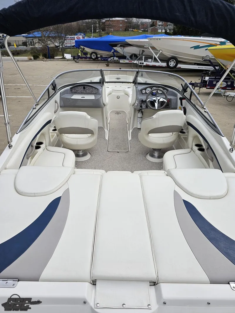 Slide: The Image of 2013 Stingray 225 LR boat with spacious seating and sleek design. - 40