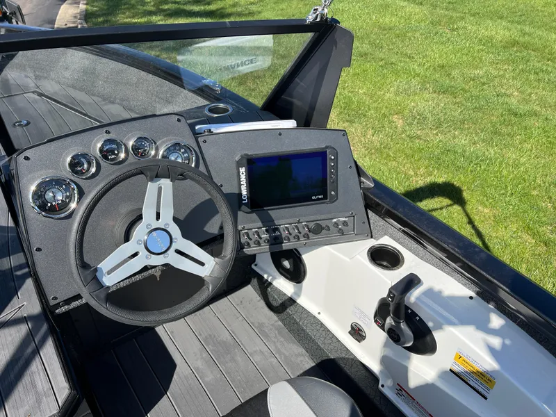 Slide: The Image of 2025 Vexus ADX190 boat dashboard with steering wheel and navigation system. - 14
