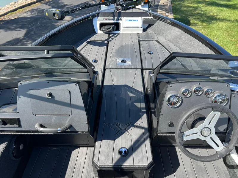 Slide: The Image of 2025 Vexus ADX190 boat interior with steering wheel and dashboard controls. - 18