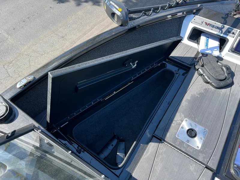 Slide: The Image of Open storage compartment on 2025 Vexus ADX190 boat deck, showcasing spacious interior. - 24
