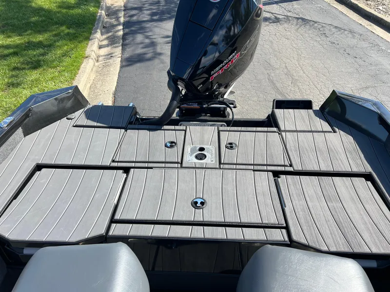 Slide: The Image of 2025 Vexus ADX190 boat deck with sleek design and powerful outboard motor. - 30