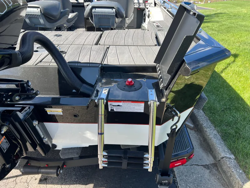 Slide: The Image of 2025 Vexus ADX190 boat with ladder and storage compartment on deck. - 34