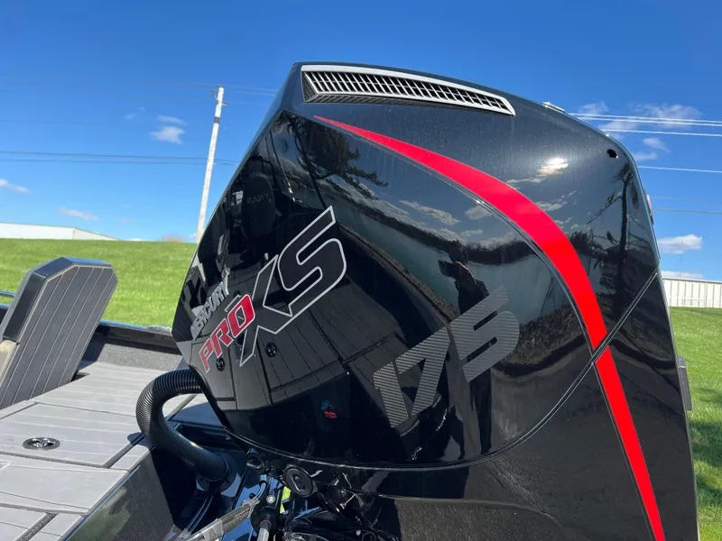 Slide: The Image of 2025 Vexus ADX190 boat with a sleek black and red Pro XS 175 engine. - 6