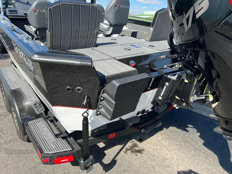 Slide: The Image of 2025 Vexus ADX190 boat rear view, showcasing seating and motor details. - 7