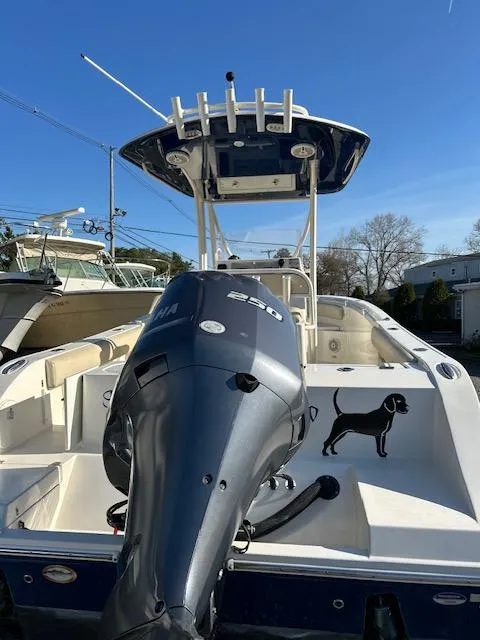 Slide: The Image of 2015 Cobia 237 Center Console boat with Yamaha outboard motor, viewed from the rear. - 6