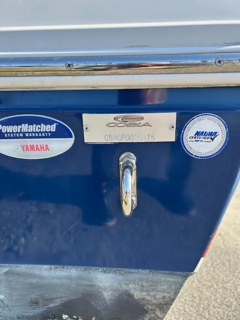 Slide: The Image of 2015 Cobia 237 Center Console boat with Yamaha warranty badge. - 7