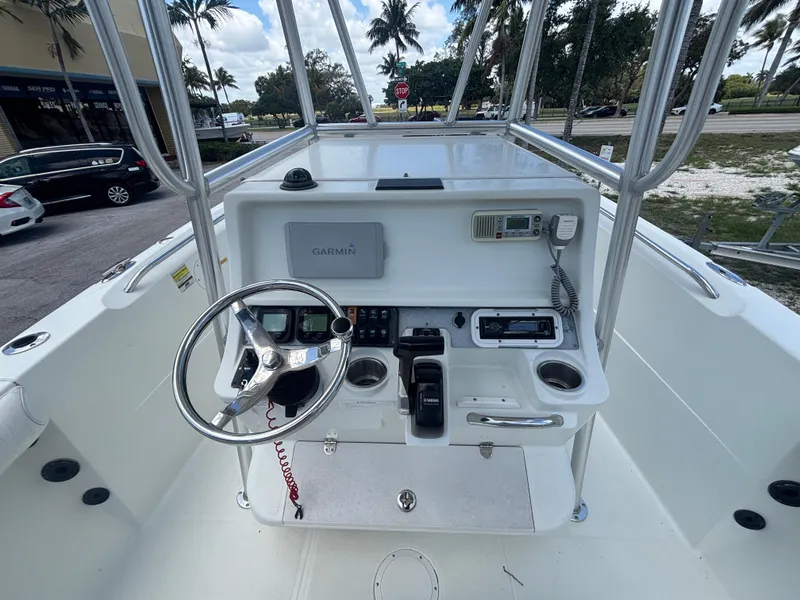 Slide: The Image of 2007 Sailfish 218 CC boat console with steering wheel and navigation equipment. - 11