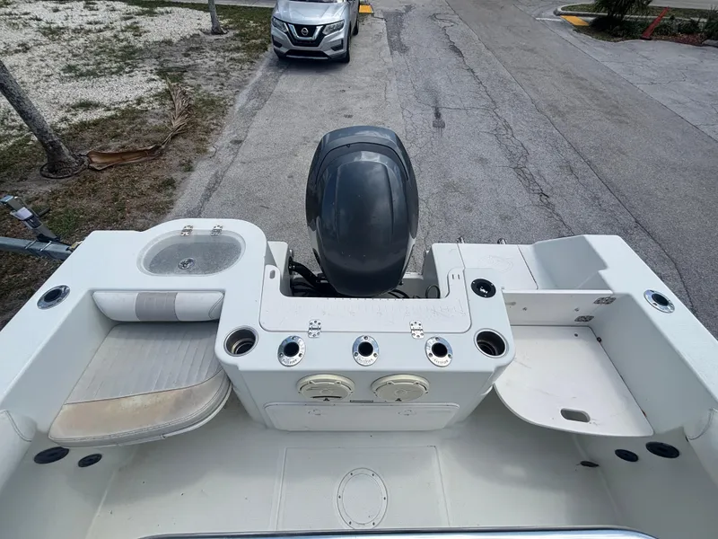 Slide: The Image of 2007 Sailfish 218 CC boat interior with motor, seating, and storage compartments. - 13