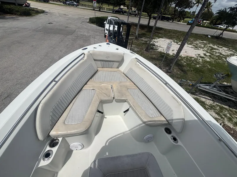 Slide: The Image of 2007 Sailfish 218 CC boat interior with cushioned seating and cup holders. - 8