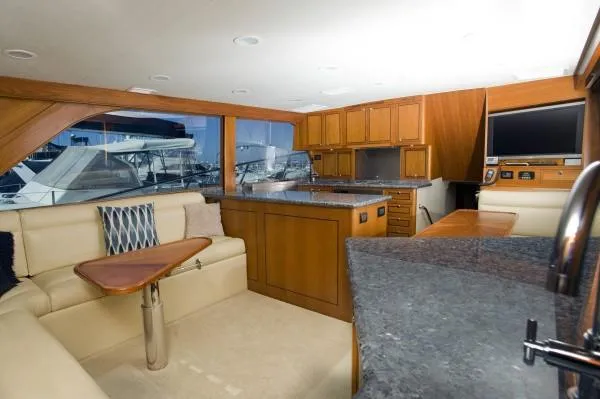 Slide: The Image of Luxurious 1982 Pacifica Convertible yacht interior with modern kitchen and seating area. - 10