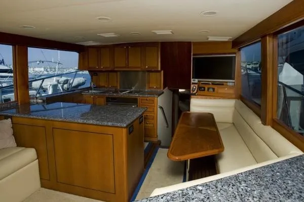 Slide: The Image of Luxurious interior of a 1982 Pacifica Convertible yacht with wood cabinetry and granite countertops. - 11