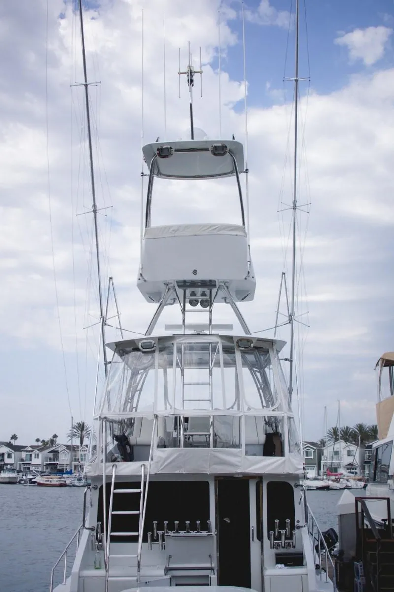 Slide: The Image of 1982 Pacifica Convertible boat with tall tower against cloudy sky. - 3