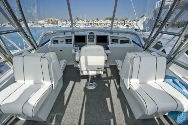 Slide: The Image of 1982 Pacifica Convertible yacht cockpit with white seating and navigation controls. - 4
